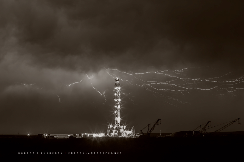 This is the sepia toned black & White version of the image "Stactic".  Static features Patterson Drilling Rig 242 iluminated...